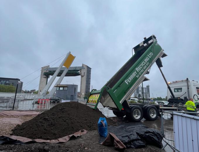 Delivery of soil into the bog garden.