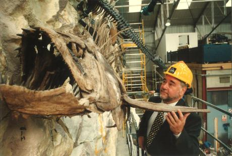 David Gemmell with hard hat on, helping to construct the fossil wall in The Deep