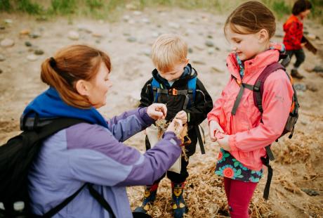 Family taking part in a shark egg case hunt.