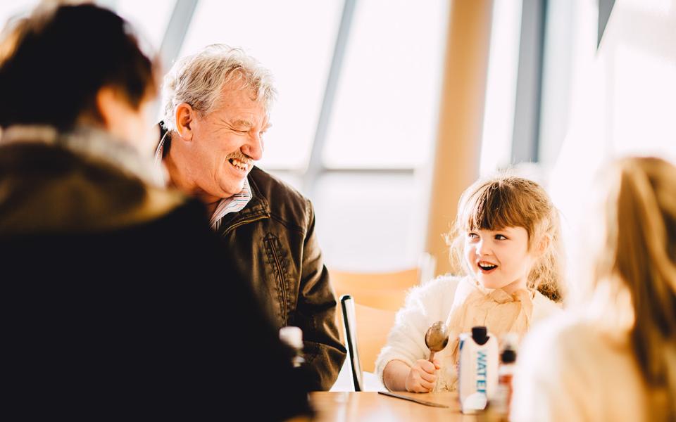 A family enjoying food in The Deep's Main Café 